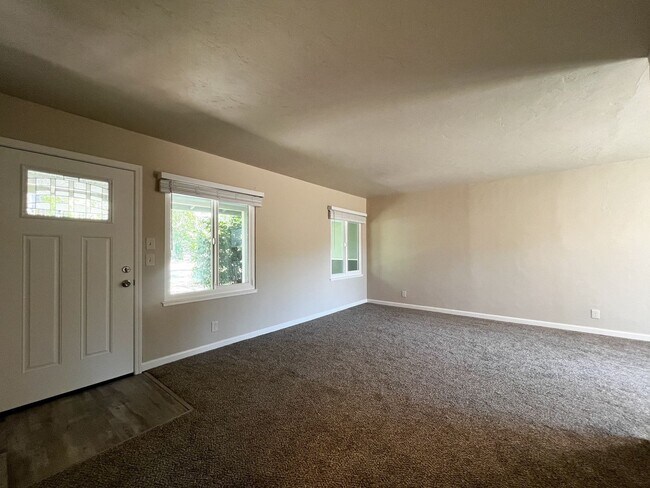 Building Photo - Freshly Renovated 3 Bedroom Home with Large Fenced Yard & Double Garage