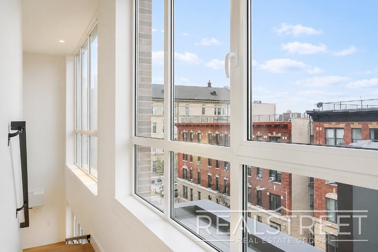Building Photo - Sun-Filled Penthouse Duplex with Massive Private Terrace & Bonus Storage Room