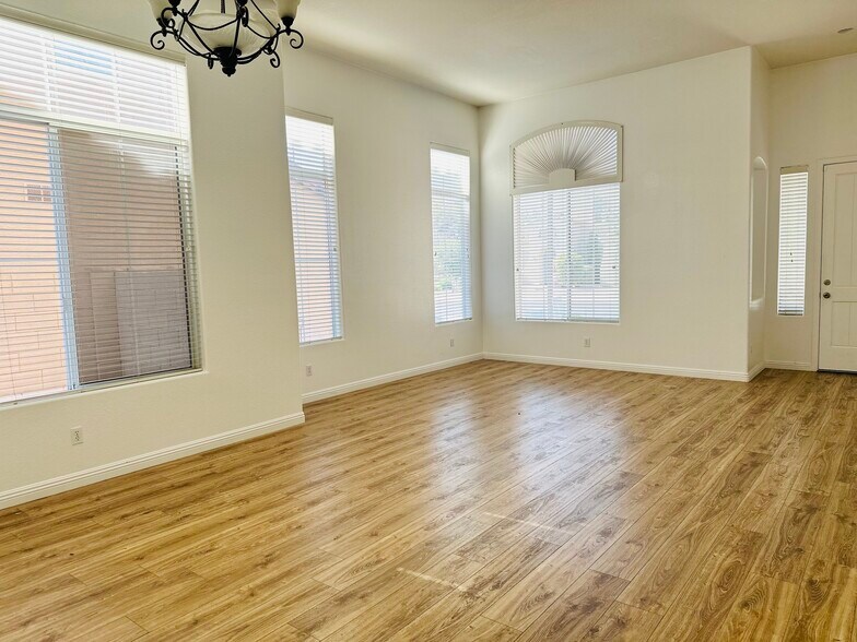 Bright formal living and dining area near the front entry. - 1177 W Laredo Ave
