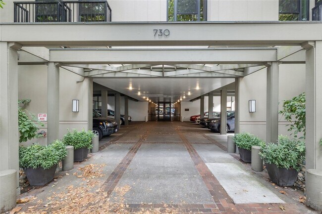 View of the lobby from the sidewalk. Your parking space is behind the building, thus even safer - 730 Bellevue Ave E