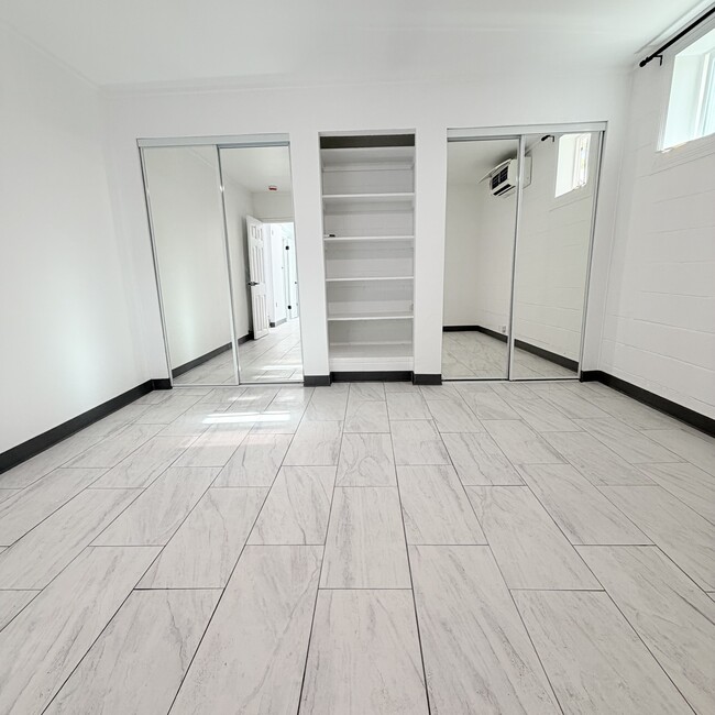 Large primary bedroom with two closets and split AC - 1739 Kamohoalii St