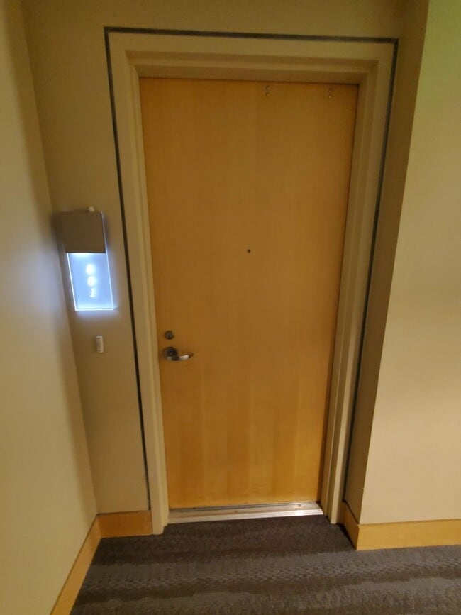 Building Photo - Downtown High-Rise Studio with parking and in-home laundry