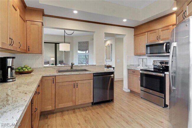 Building Photo - 7008 Pelican Bay Blvd