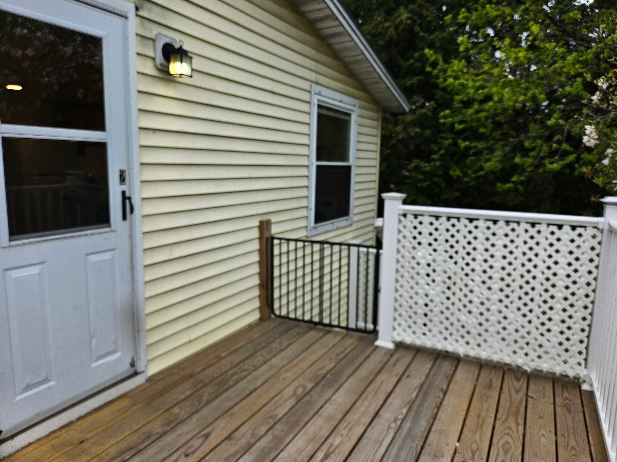 entrance features private 8x8 deck overlooking backyard - 132 Hinesburg Rd