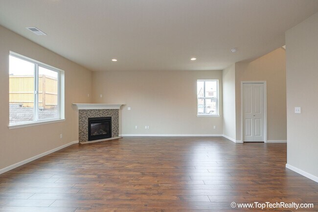 Building Photo - Spacious 4-Bedroom + Office Home in Abbey Creek – Modern Finishes, EV Charger & Low-Maintenance B...