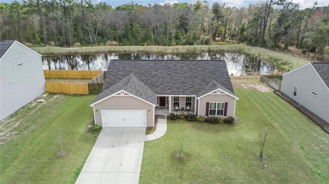 Building Photo - Relax & Unwind at this 4-Bedroom Home with Scenic Lagoon Views in Rincon