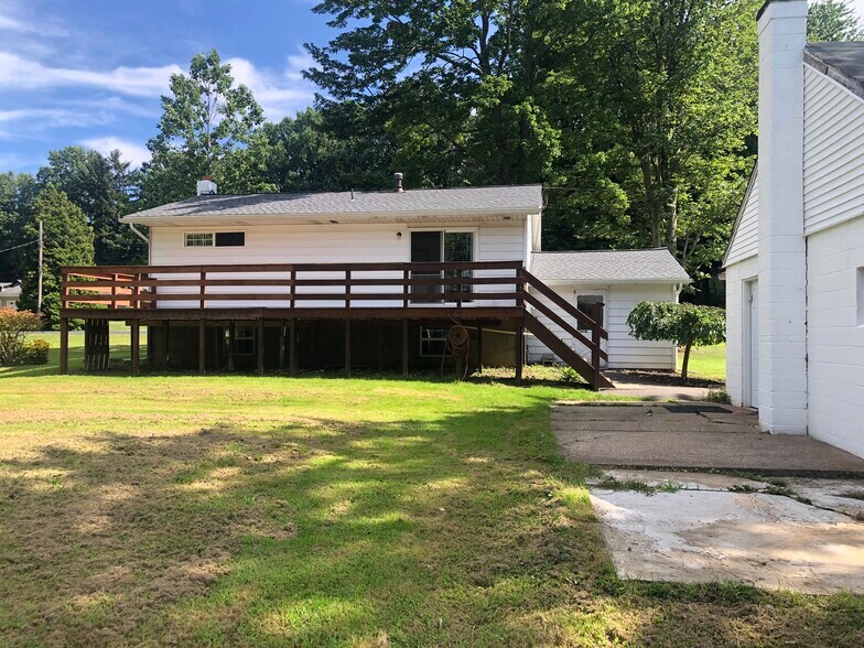 Sliding back door off of dining room and 12x30 deck, back of the garage is to the right - 3243 Hemlock Dr
