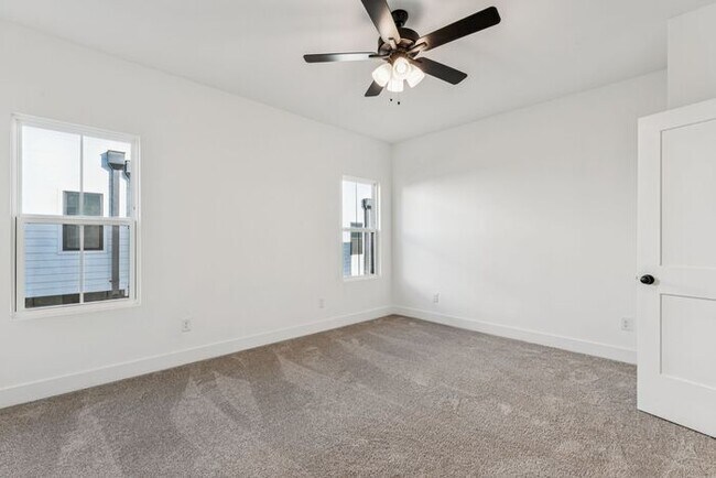 Building Photo - High-End 2BR Townhome | Rooftop Terrace + 2-Car Garage | 24-Unit Commnity