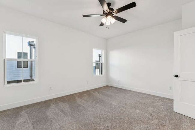 Building Photo - High-End 2BR Townhome | Rooftop Terrace + 2-Car Garage | 24-Unit Community