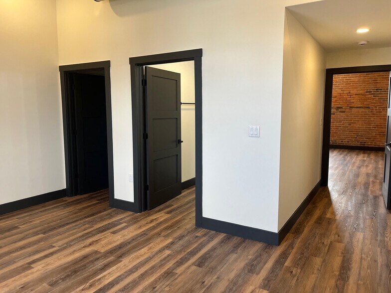 Primary bedroom with bathroom and walk-in closet - 101 W Broadway St