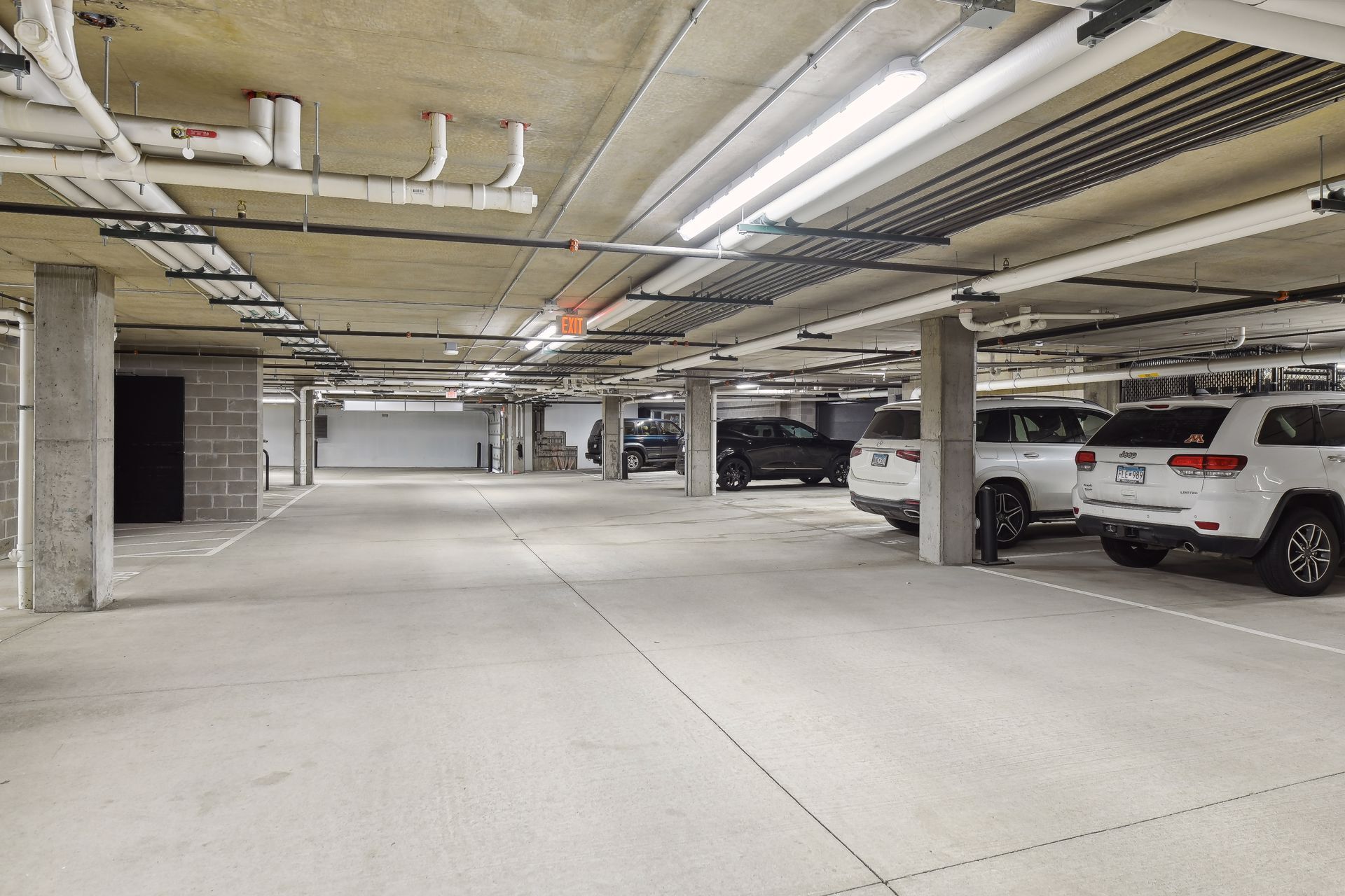 Two parking stalls and a storage locker in the heated garage come with this unit - 222 Ferndale Rd S