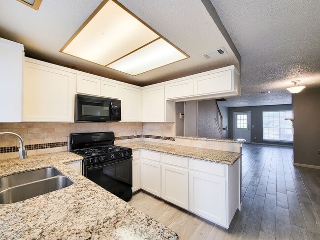 Building Photo - Welcome to This Charming Townhome Nestled ...