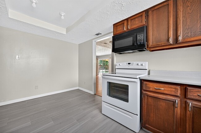 Building Photo - 8623 Riverside Walk Ln