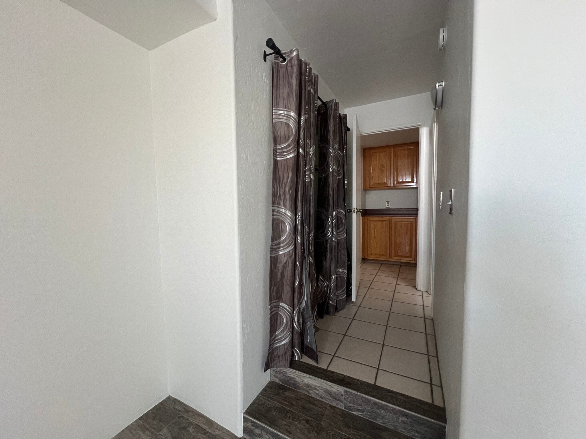 View from primary bedroom to primary bath, storage and hallway - 5675 N Camino Esplendora