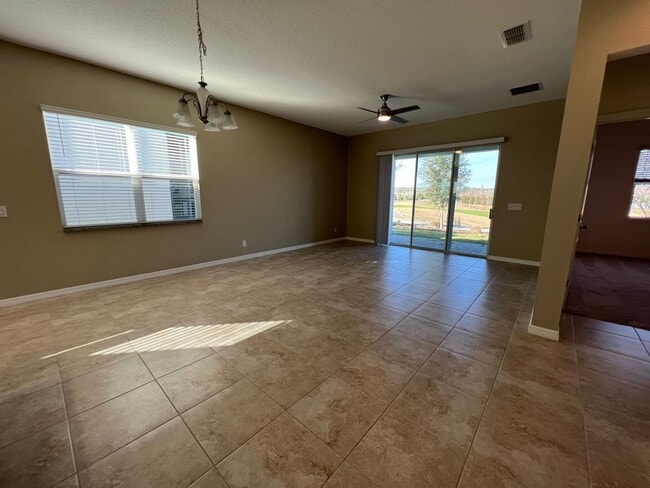 Building Photo - 55+ community in Four Seasons of Orlando 2 bedroom, 2 bathroom, with a 2 stall attached garage on...
