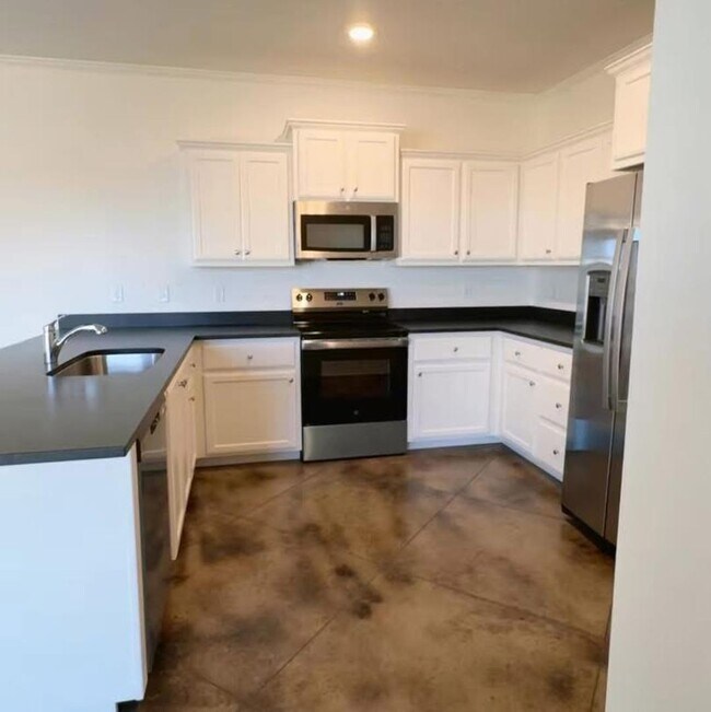 Building Photo - Stunning New 3/2 Townhomes