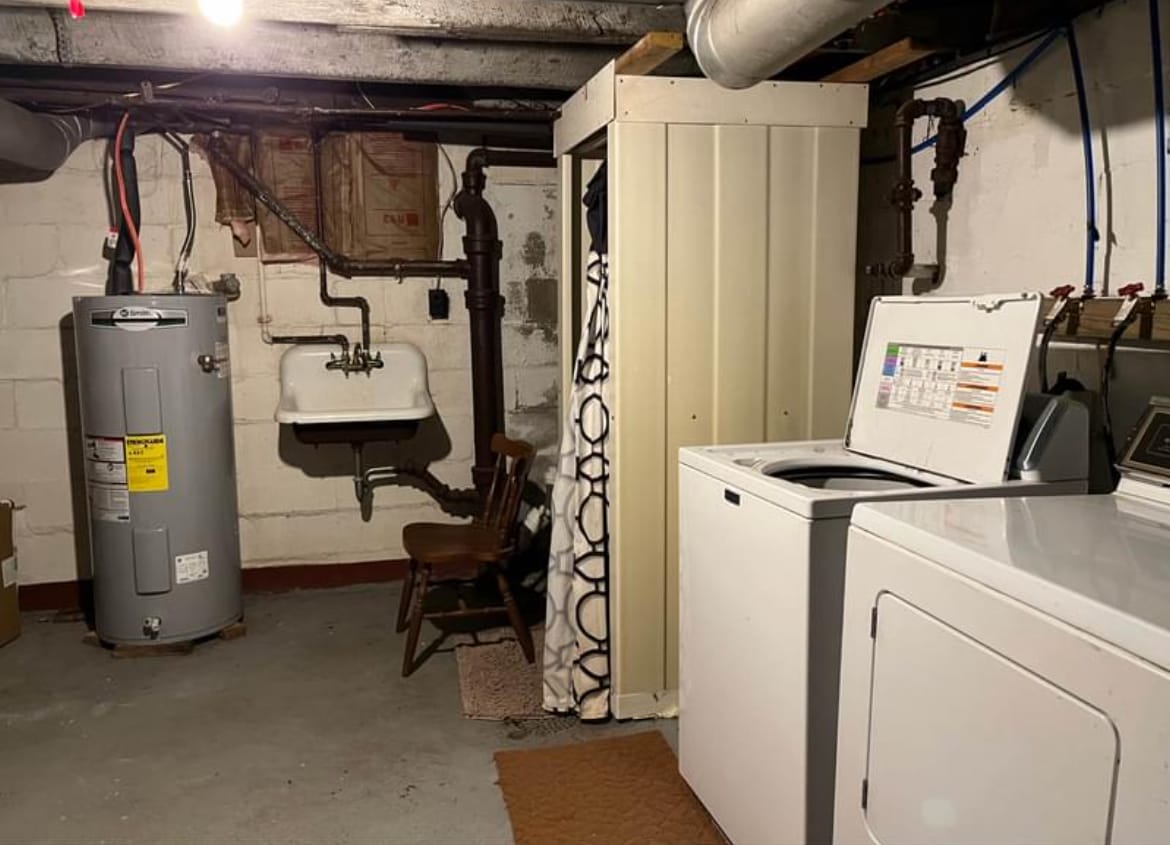 shower in the basement with provided washer in dryer - 200 E 6th St