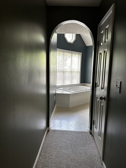 Hall in Primary from bed to bath with closet - 2595 Thackery Rd