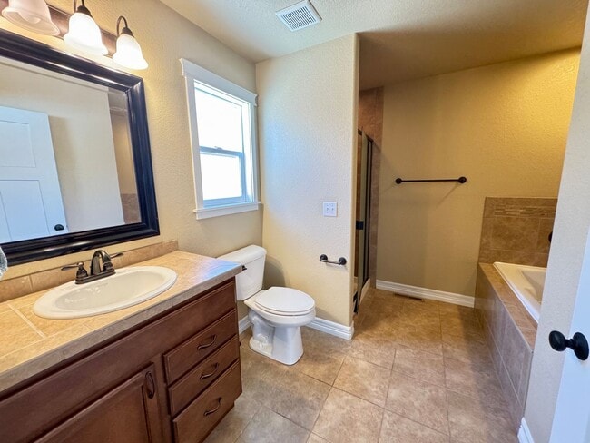 Building Photo - 4 BEDROOM, 3 BATHROOM TWINHOME WITH 2 CAR ATTACHED GARAGE IN NORTH CHEYENNE