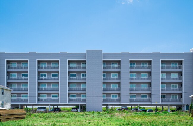 Building Photo - SPEND YOUR OFF-SEASON AT THIS TOP FLOOR OCEANFRONT CONDO