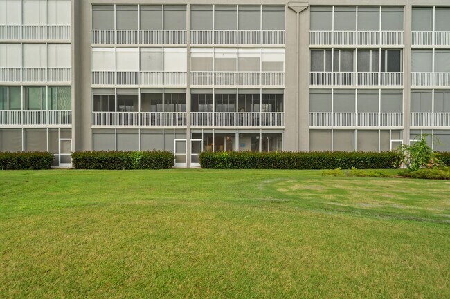 Building Photo - first-floor unit featuring a 2 bedroom, 2 bath fully furnished