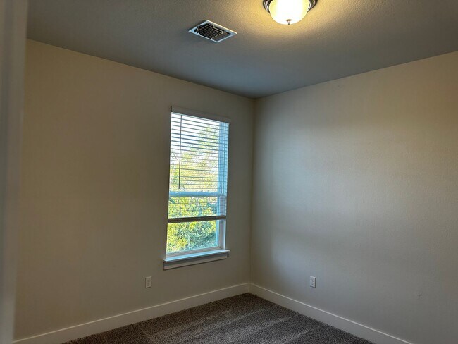 Building Photo - For Lease – Modern 2023 Condo Backing to Greenbelt | Creekside at Pioneer Crossing West