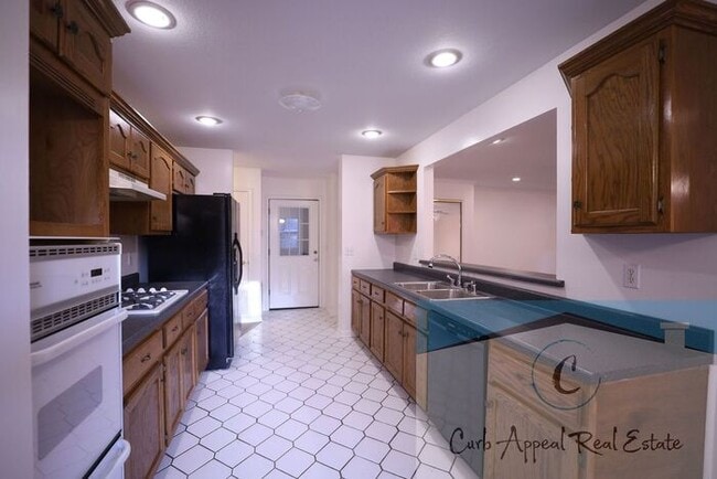Building Photo - First month move in special $900!! Beautiful 3-bed, 2 bath condo with fireplace, 2-car garage - i...