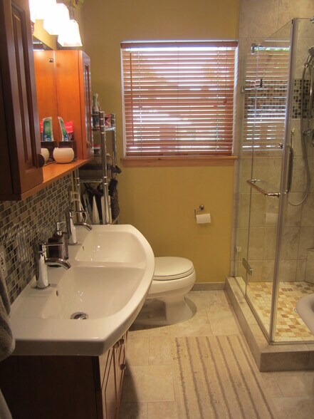Updated bathroom, double sinks, modern European styling. - 7605 Robinson Way