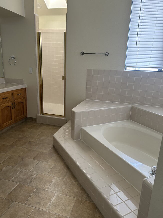 Bathroom with a shower and bathtub - 661 W Fargo Ave