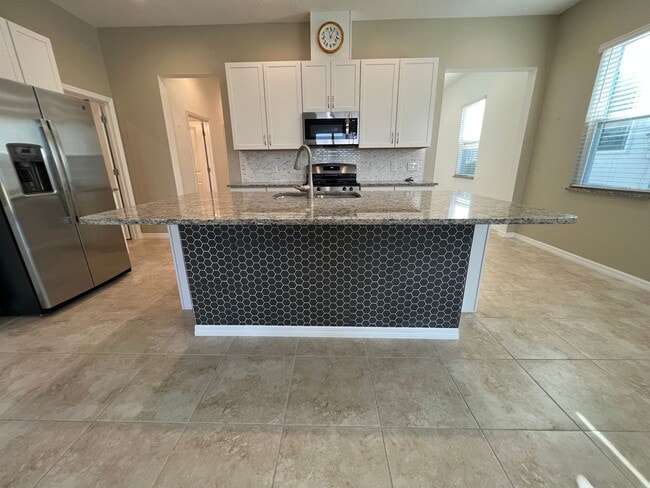 Building Photo - 55+ community in Four Seasons of Orlando 2 bedroom, 2 bathroom, with a 2 stall attached garage on...