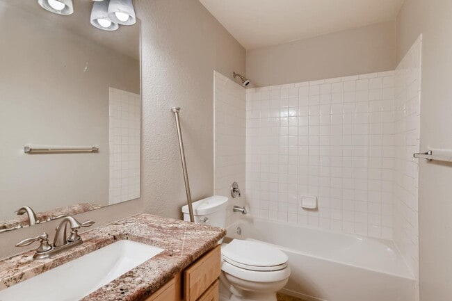 Building Photo - Stunning 3-bed 3-bath townhome that features hardwood floors and an attached 2-car garage!