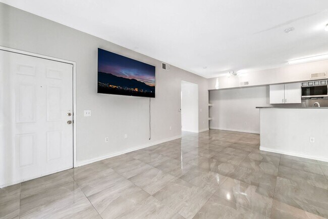 Building Photo - Modern Gated Condo with Upgraded Interior and Attached Garage in Prime South Las Vegas Location!