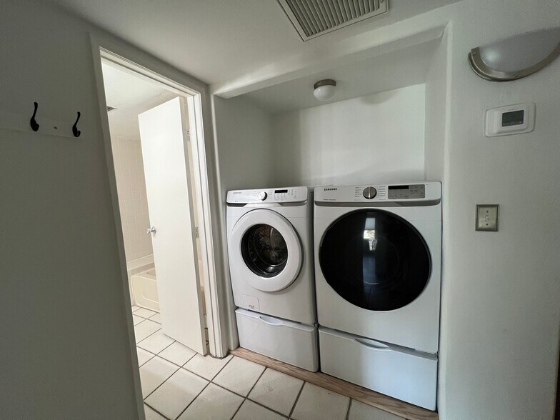 Washer and dryer + entrance to guest bathroom - 5675 N Camino Esplendora