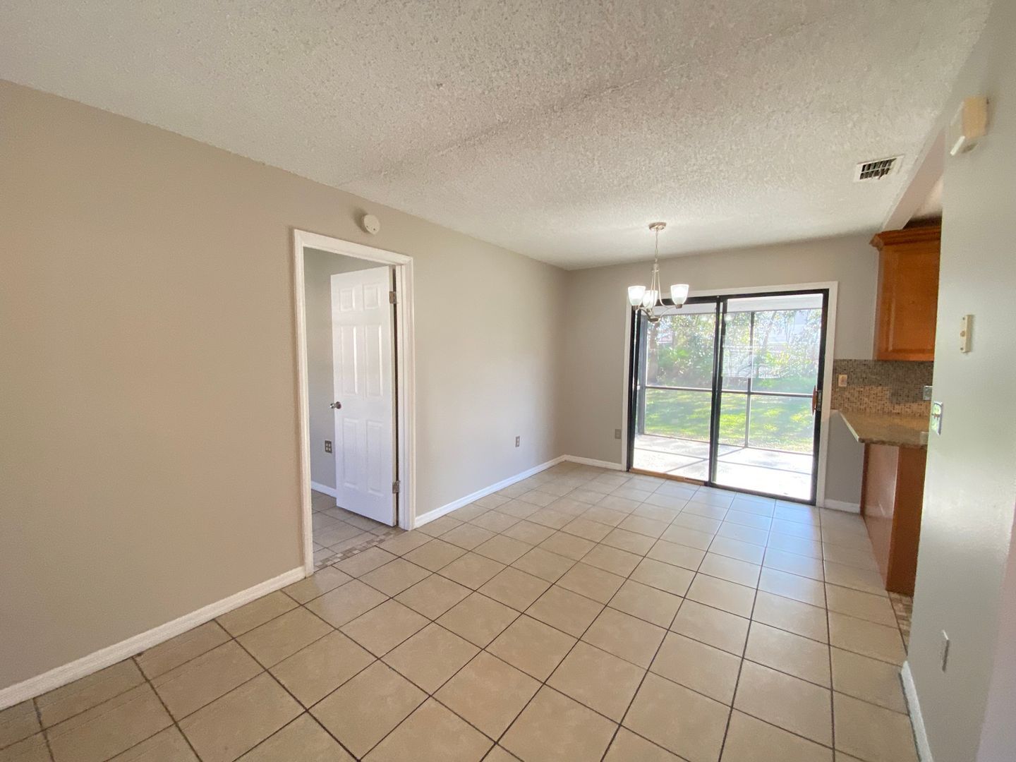 Building Photo - 2/2 home with garage - tile on inside with...