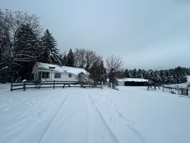 Building Photo - Bigfork Rodeo Farmhouse~ Fenced garden, greenhouse, garage, barn and shop!