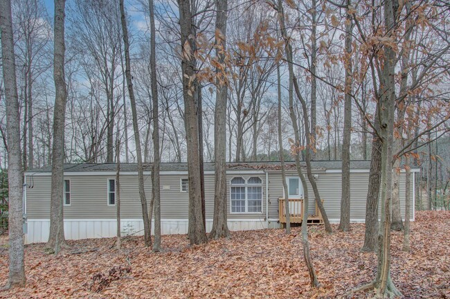 Primary Photo - Nestled on a spacious, private wooded wate...