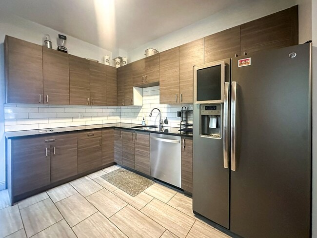Building Photo - A home where old-world charm meets modern sophistication!