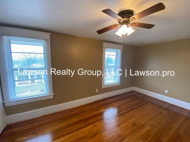 Building Photo - Updated Three Bedroom with Flat Yard