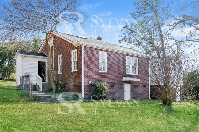 Building Photo - The living is easy in this 3 bedroom, 2 bathroom brick home