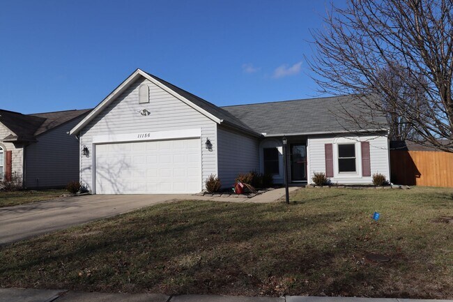 Building Photo - Discover this well-maintained 3-bedroom, 2-bath home in Indianapolis featuring an attached garage...