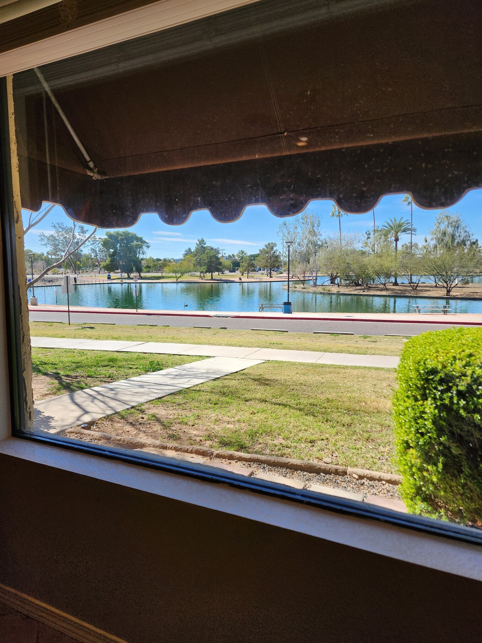 Calming park and lake views from front rooms. Watch for sunsets. - 5050 N 81st St