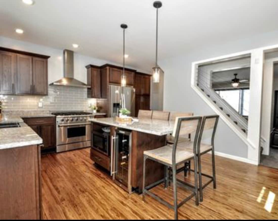 Updated kitchen with stainless steel appliances and island seating - 2328 Primrose St