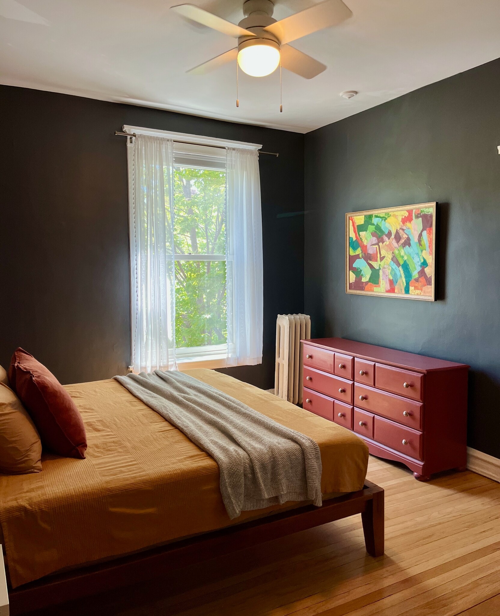 Spacious main bedroom with an attached bathroom. - 5142 S Greenwood Ave