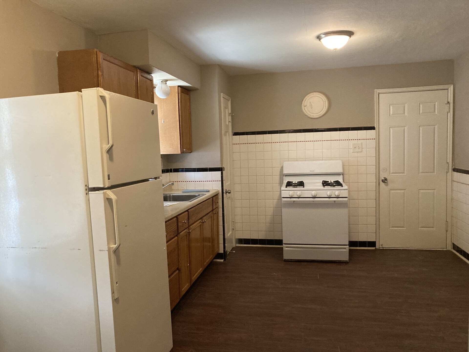 Kitchen with Stove and Large Fridge - 5614 Gatesworth Ave