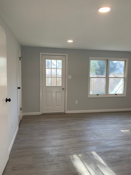 bedroom with door to small outside patio - 343 Calvert St