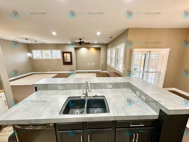 Building Photo - Open Kitchen, Expansive Living, and Covered Patio in Tranquil South Reno Near Trails, Parks & Sho...