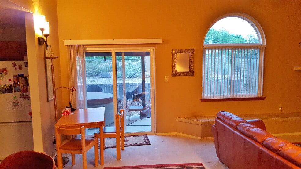 Downstairs living room and dinning area looking out toward the golf course. - 6436 Saint Josephs Ave NW