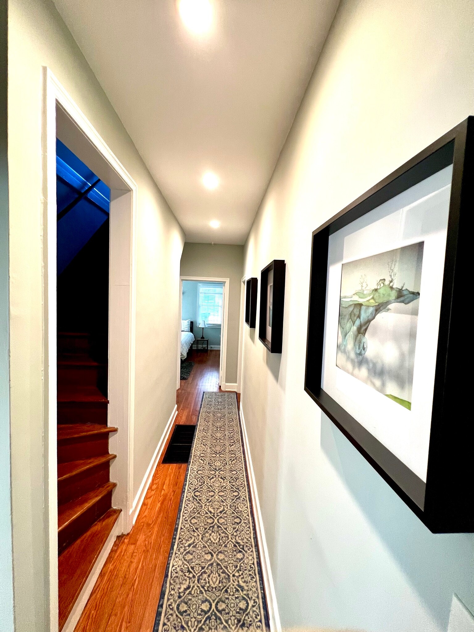 Hall way to bedrooms and bath in main floor - 2506 E Woodland Cir