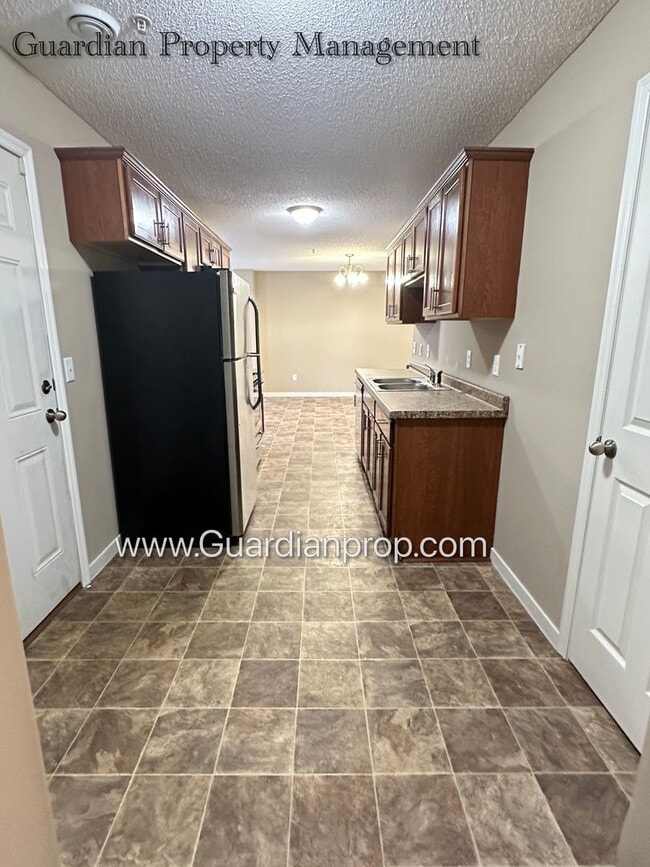 Building Photo - North Brooklyn Park Town Homes, Dedicated Office, 2 Car Garage, Washer/Dryer, Front Patio