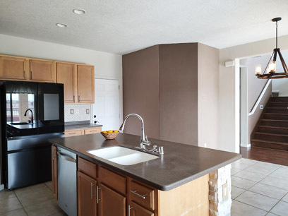 Kitchen with garage door in center - 3544 Plano Vista Rd NE